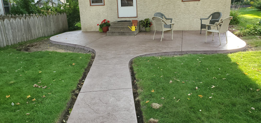 Belgium slate stamped concrete walkway & patio, installed by Creative Concrete