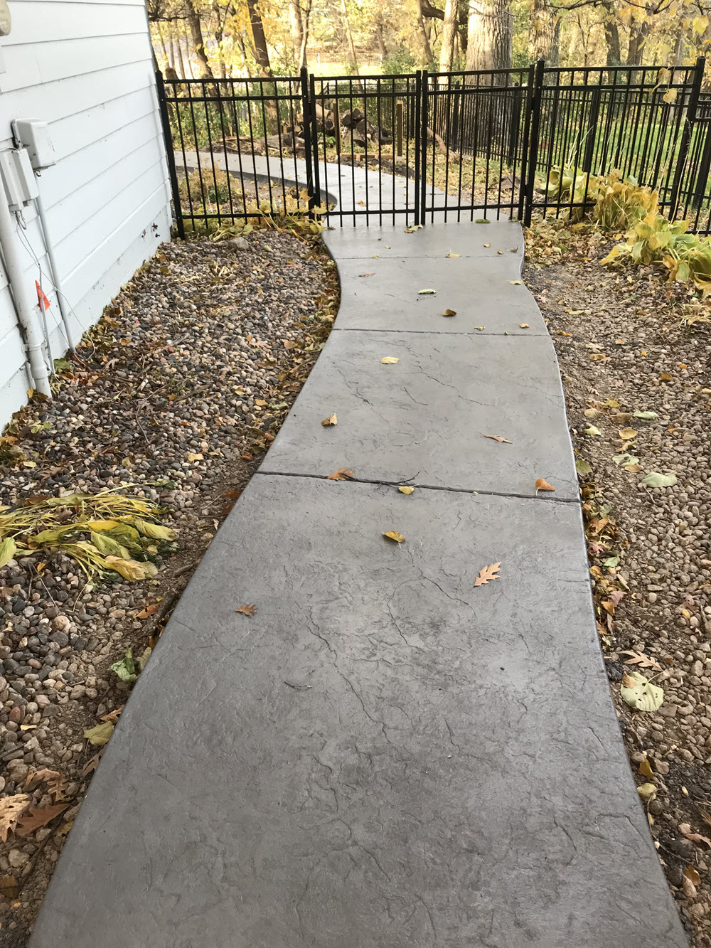 Belgium slate stamped concrete walkway, installed by Creative Concrete