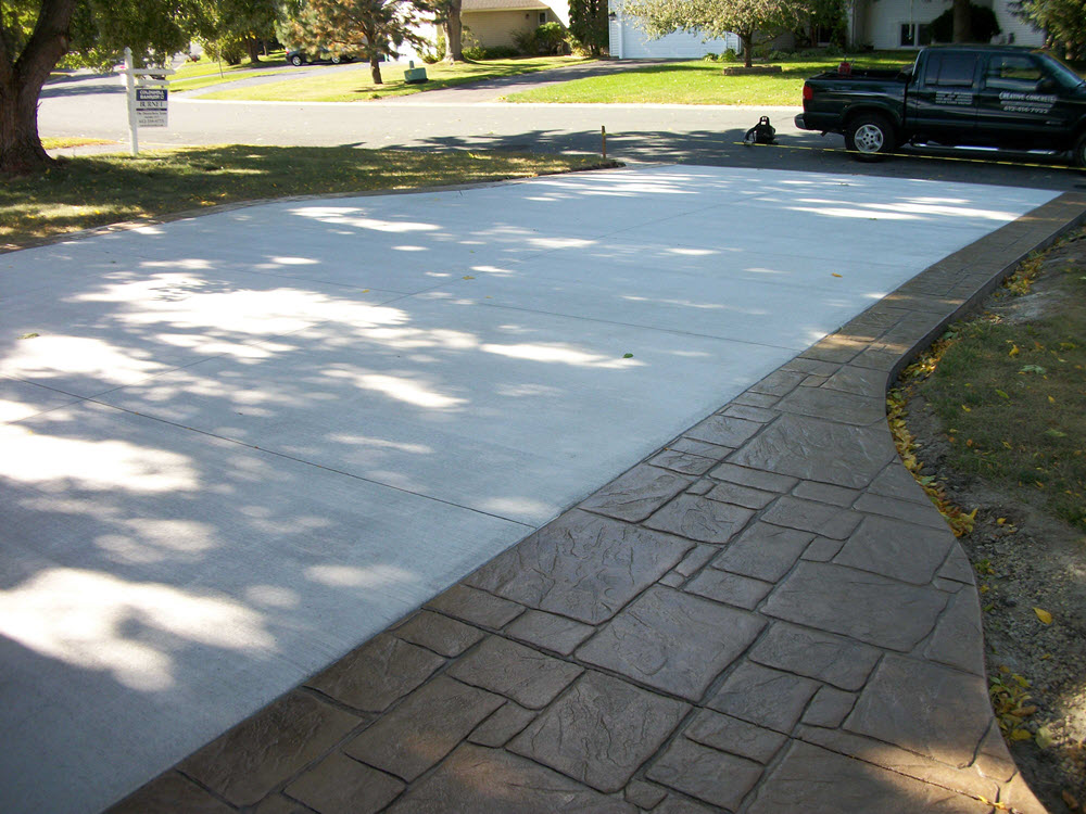 Concrete driveway with stamped concrete walkway, installed by Creative Concrete Concrete driveway with stamped concrete walkway, installed by Creative Concrete