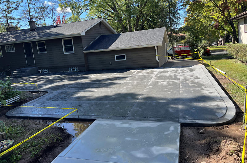 Stamped concrete patio and poured concrete walkway in White Bear Lake, by Creative Concrete Inc