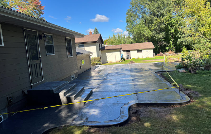 Stamped concrete patio and poured concrete walkway in White Bear Lake, by Creative Concrete Inc