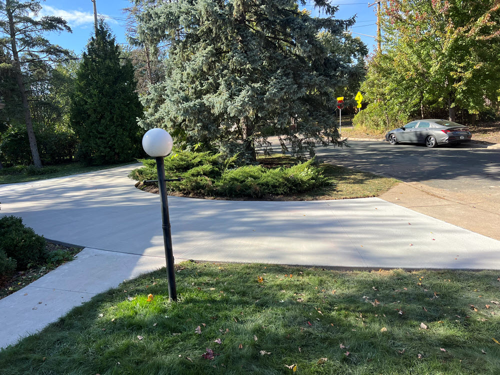 Poured concrete driveway + walkway installed in Golden Valley MN by Creative Concrete Inc