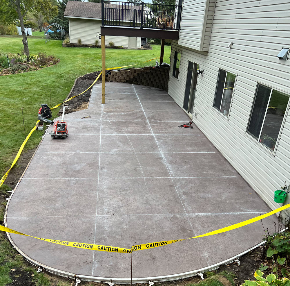 Poured concrete patio installed in Rogers MN by Creative Concrete Inc
